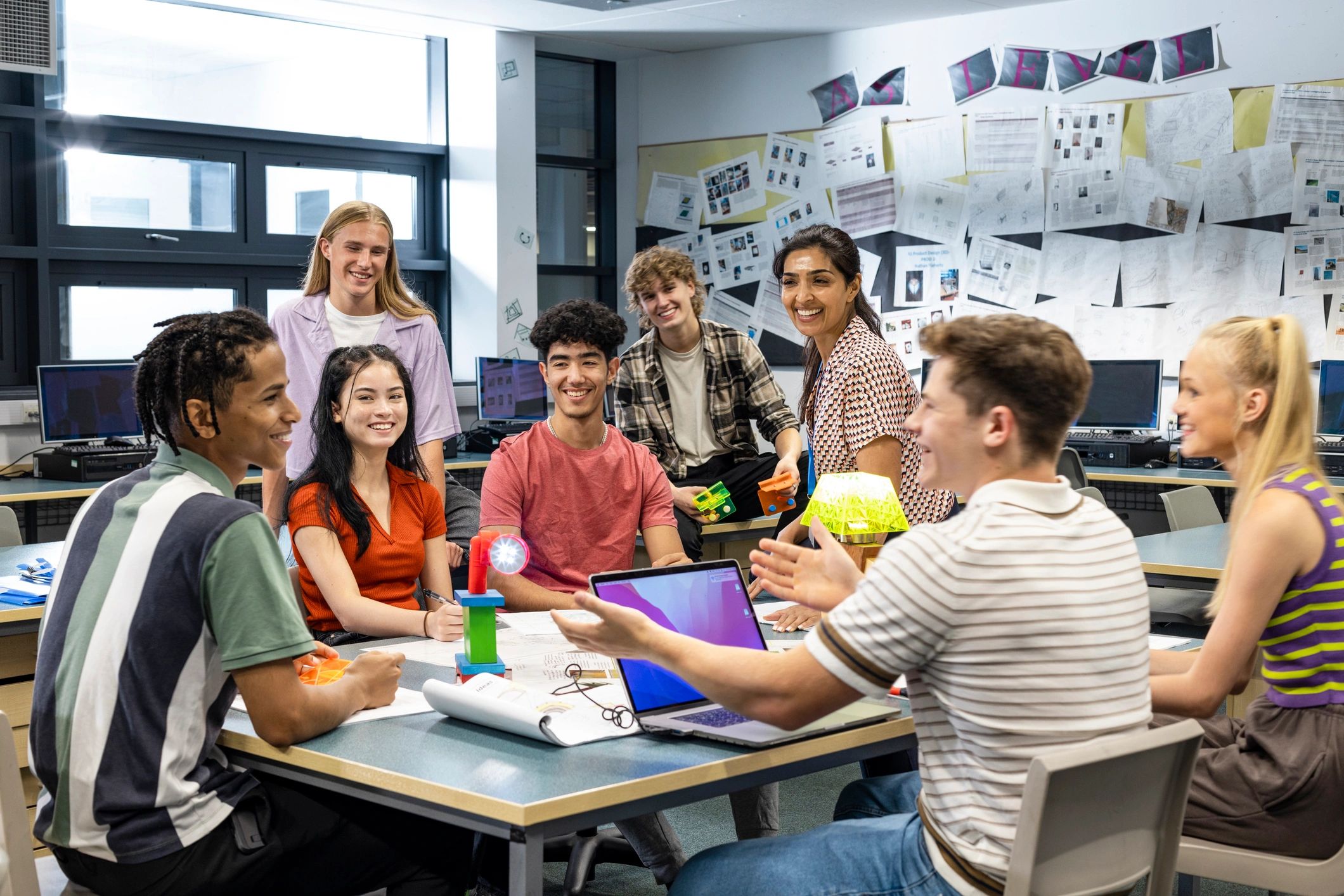 Teacher and students collaborating in a classroom