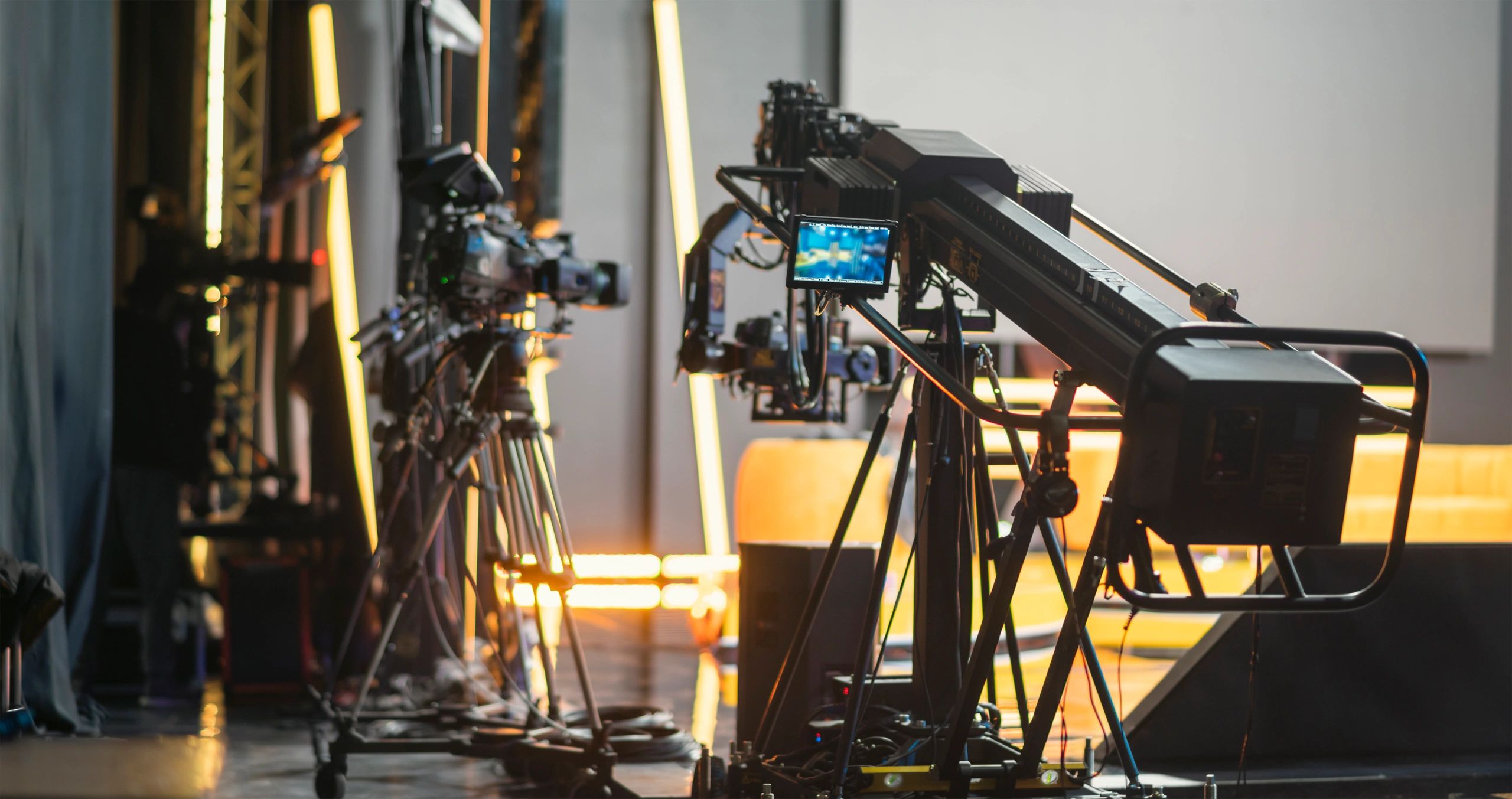 Modern news studio with cameras and live monitors