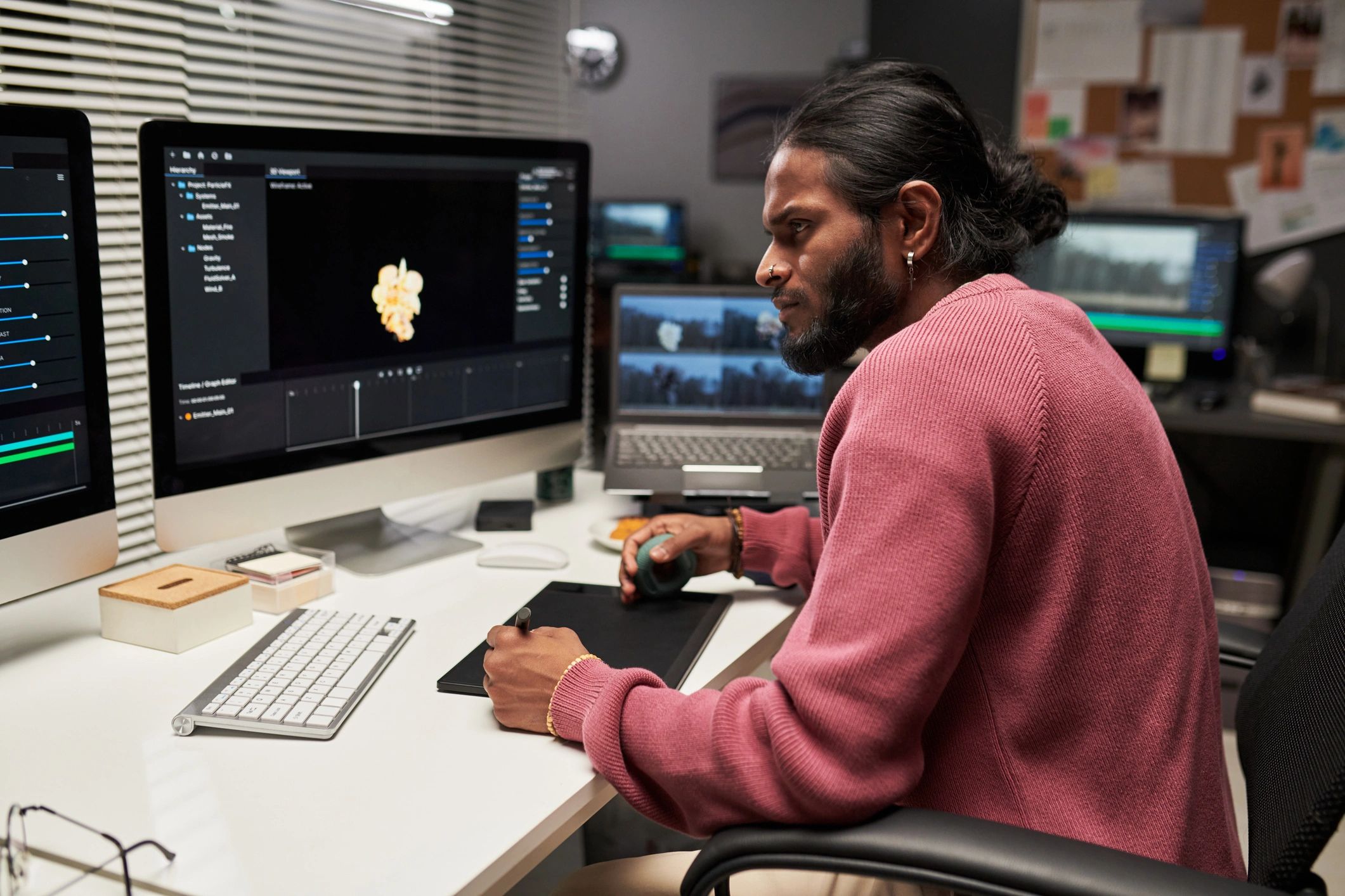 Creator editing digital content at a professional workstation